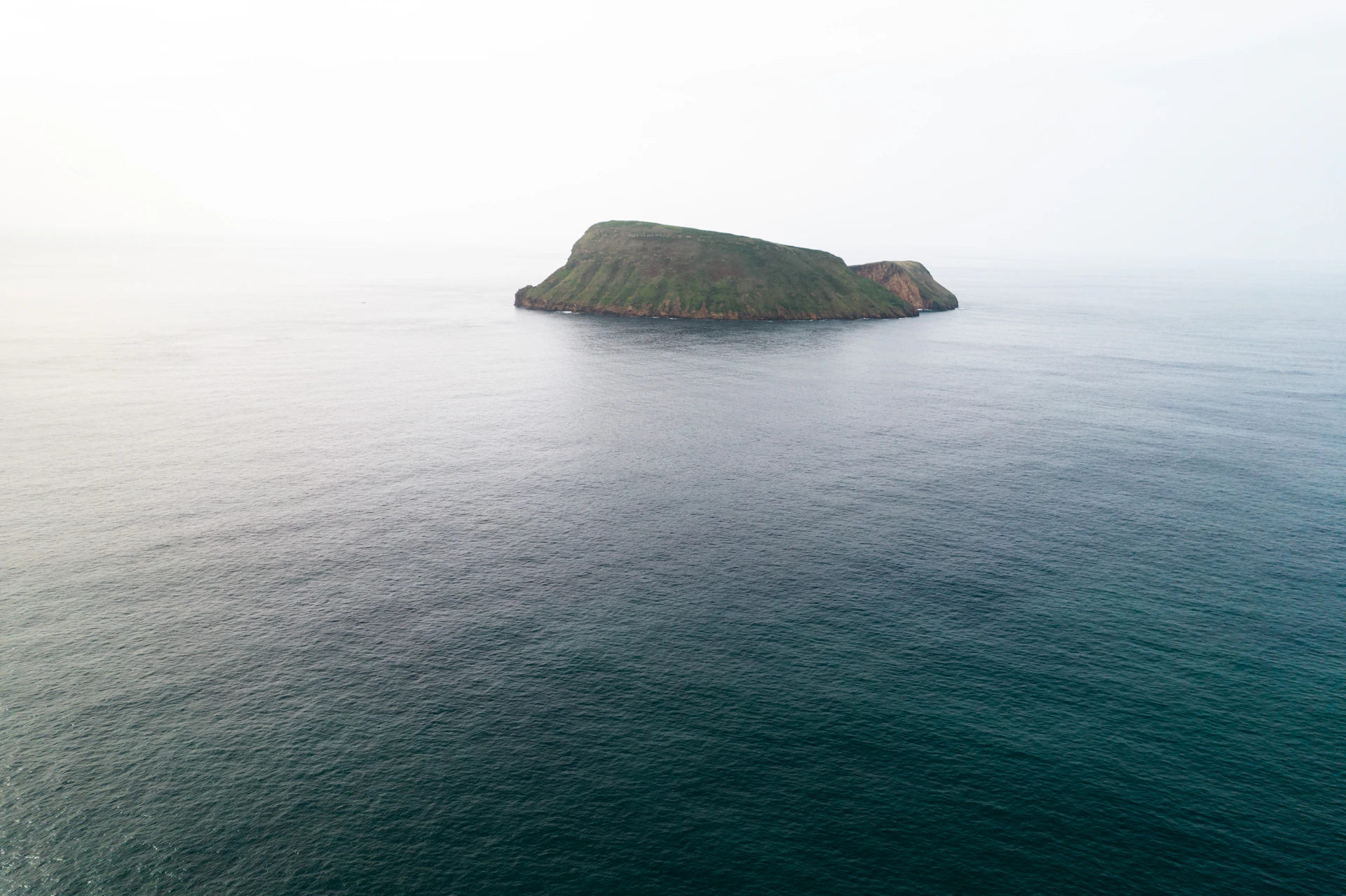 a small island in the middle of the ocean