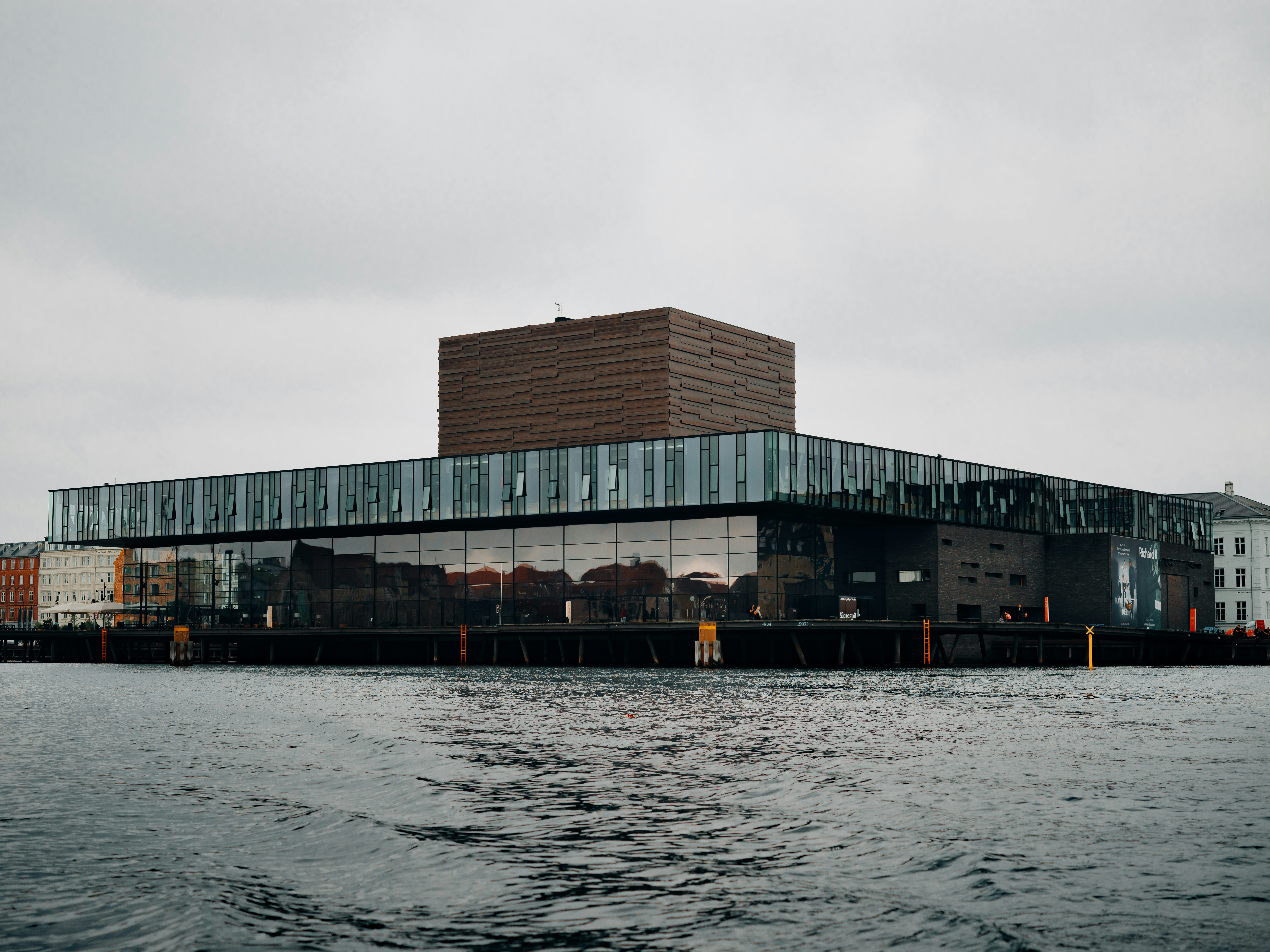 a large building sitting on top of a body of water