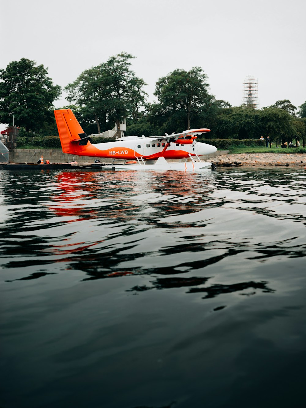 a small plane sitting on top of a body of water