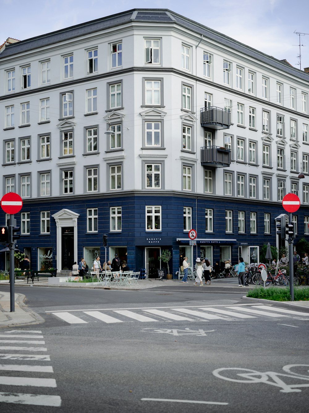 a street corner with a blue building in the background