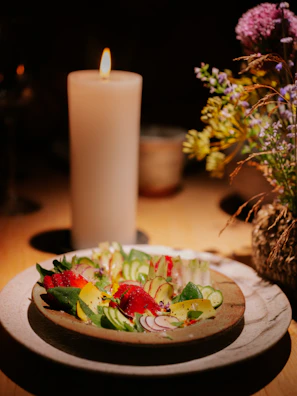 Artful arrangement of kerabu mangga salad with vibrant colors on a wooden table.