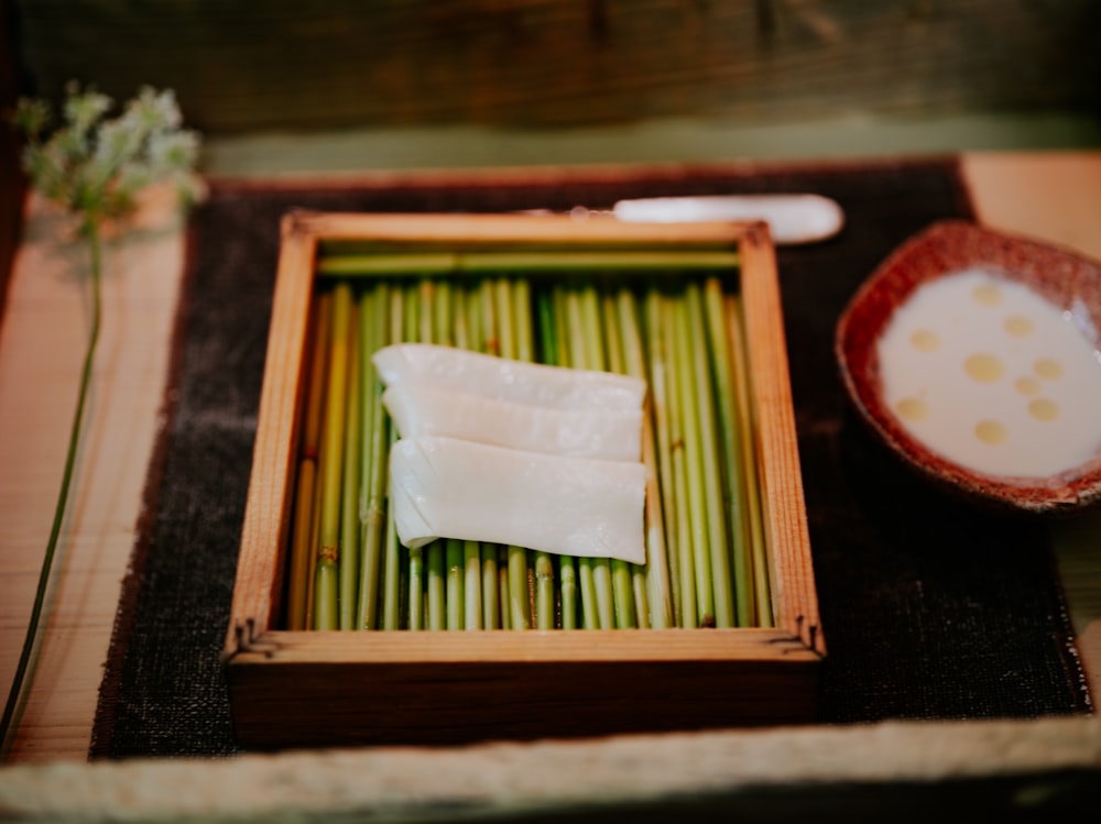 a plate of food on a table with chopsticks