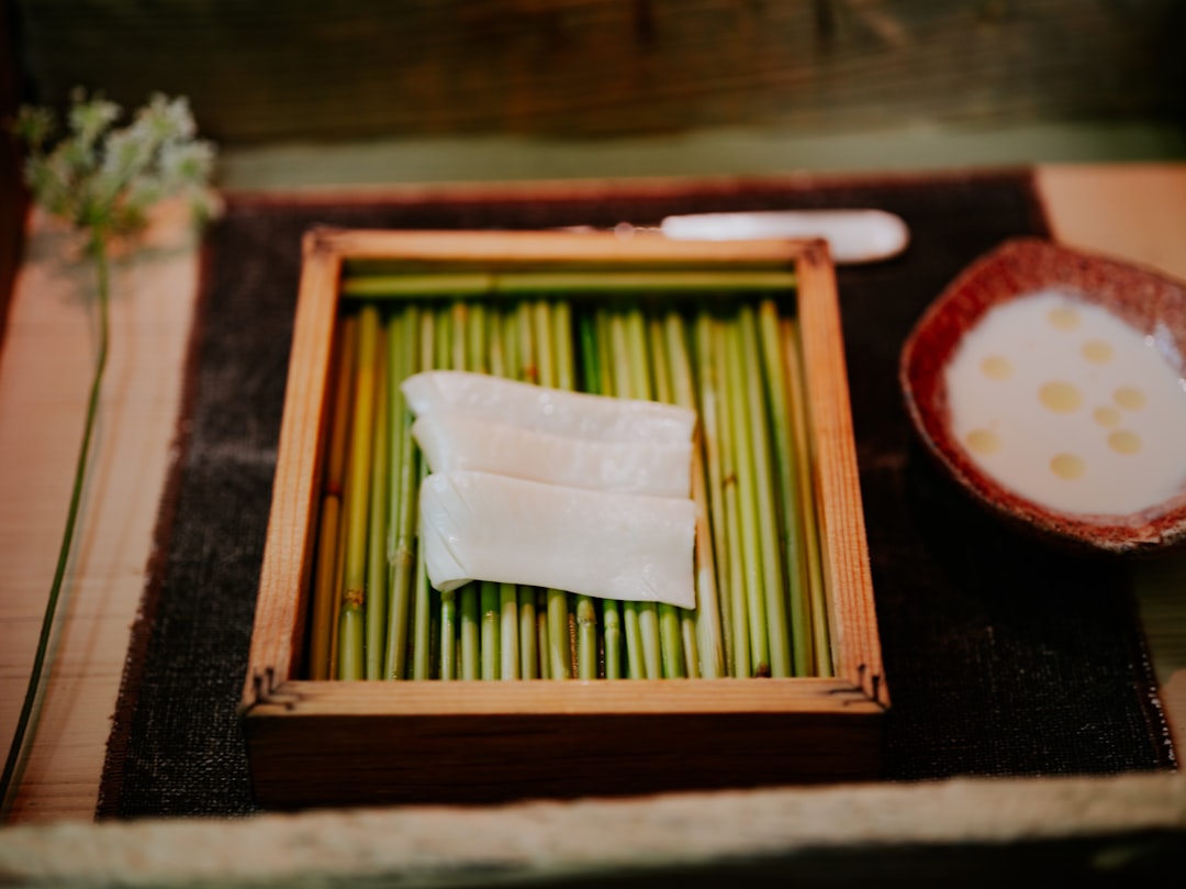 a plate of food on a table with chopsticks,