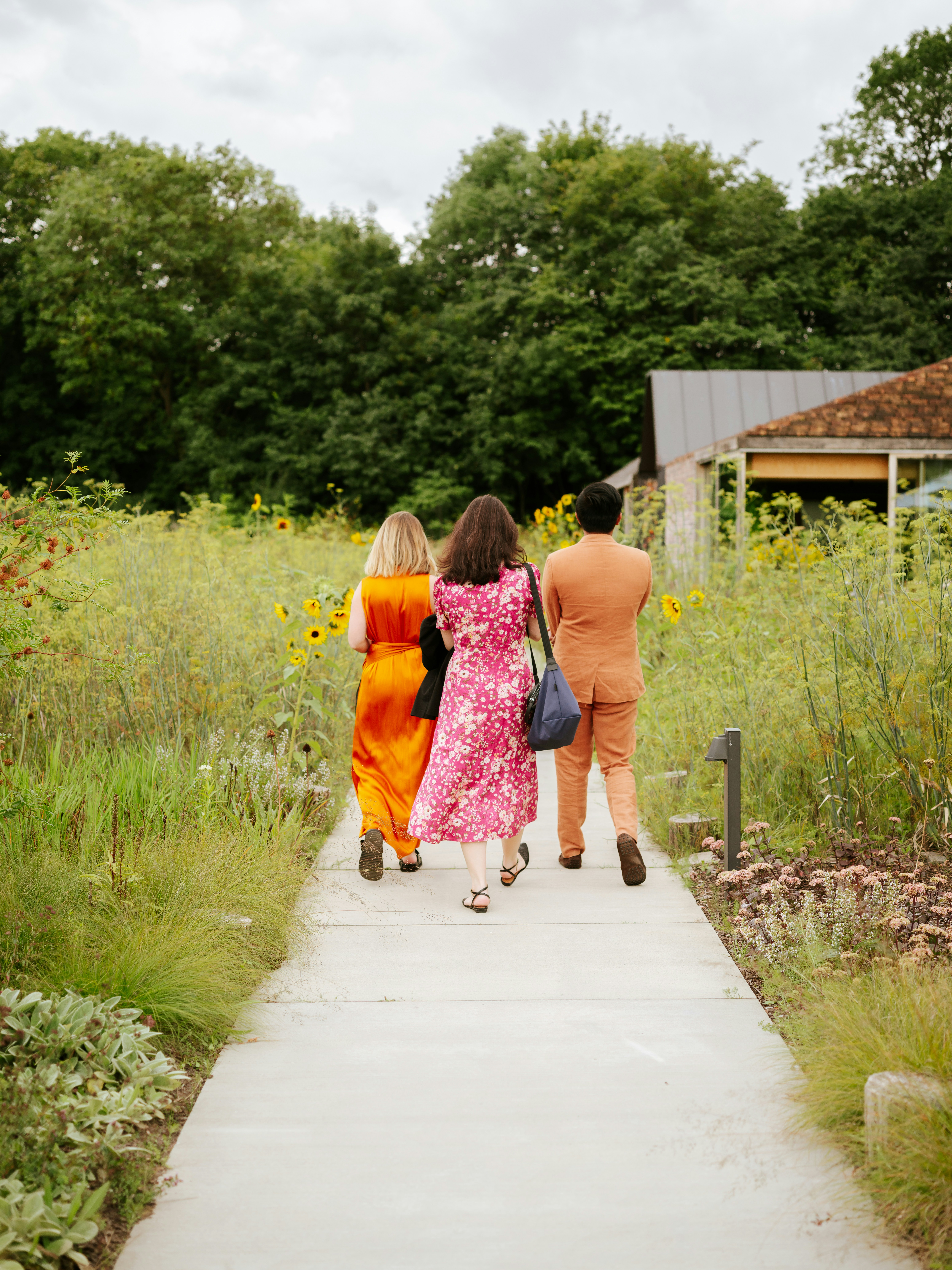woman wearing yellow long-sleeved dress under white clouds and blue sky during daytime