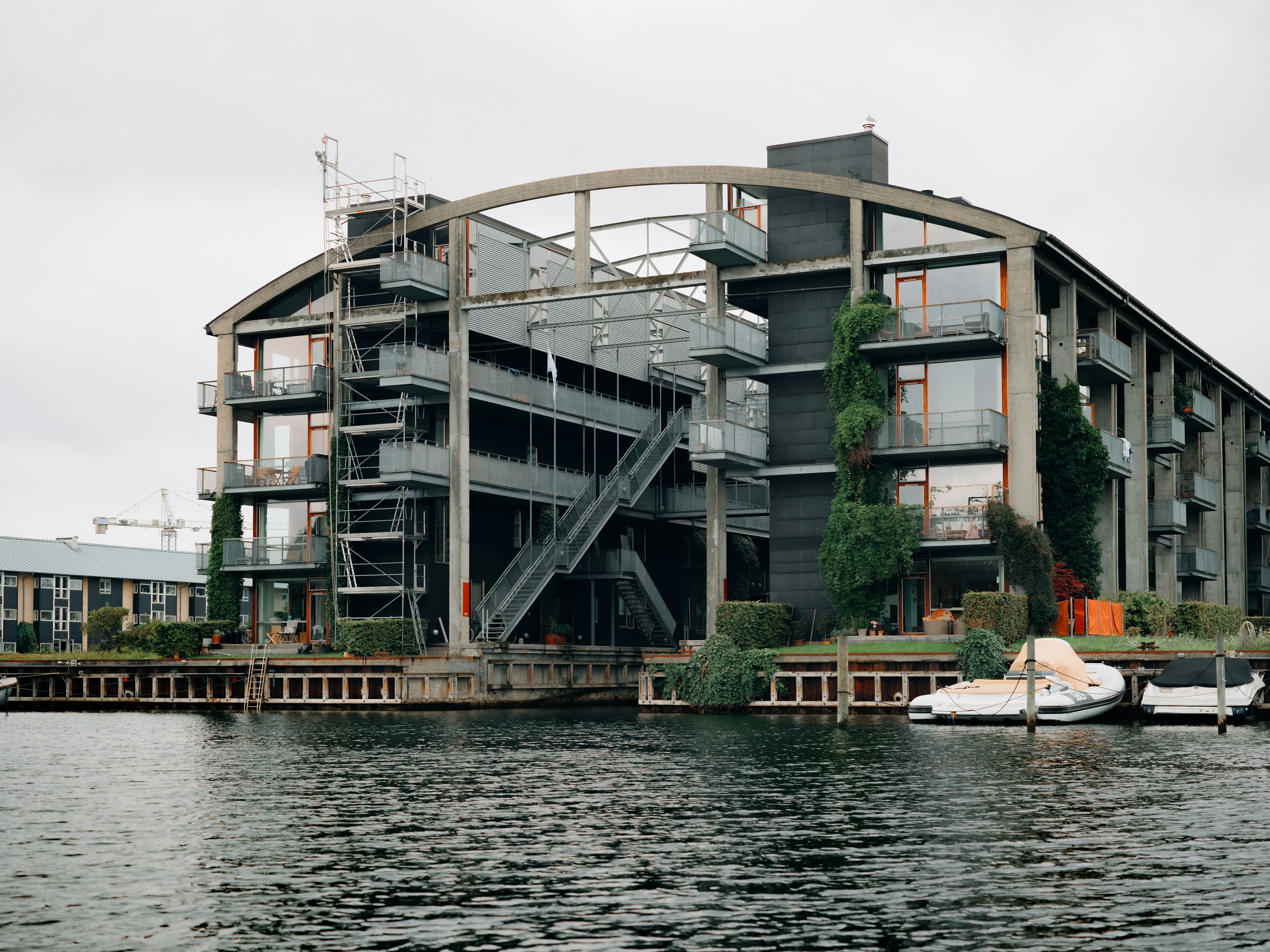 a boat is parked in front of a large building