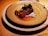 A rustic seafood dish beautifully plated on a wooden table.