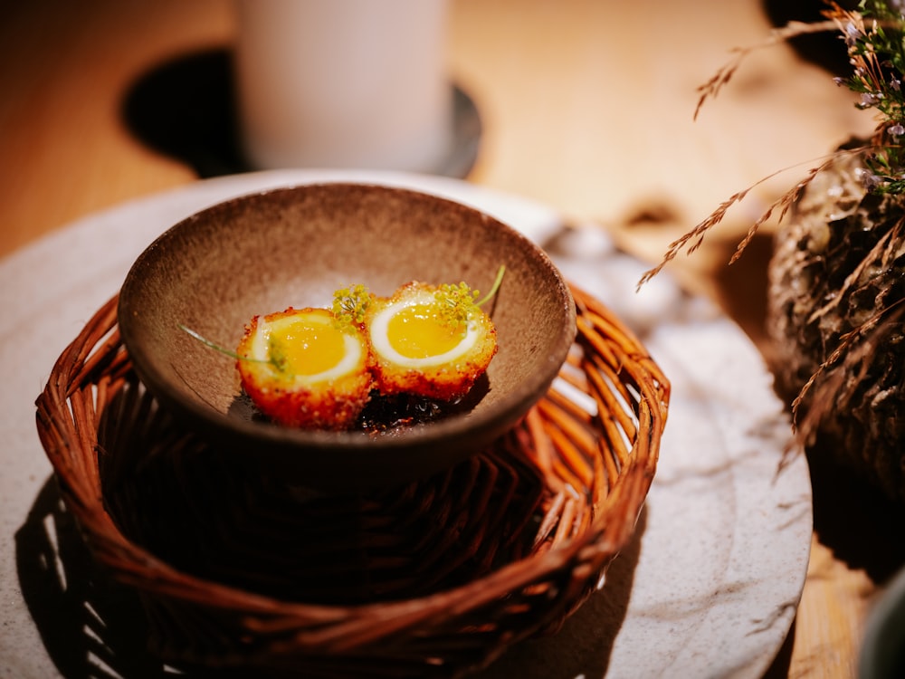 a bowl of food sitting on top of a table