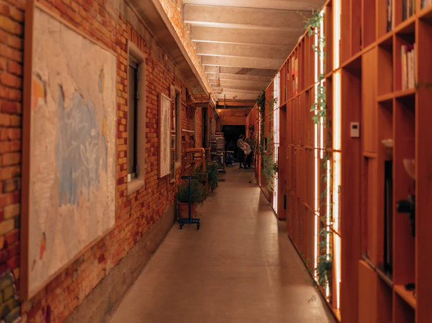 Hallway of the hostel with soft lighting and welcoming decor.