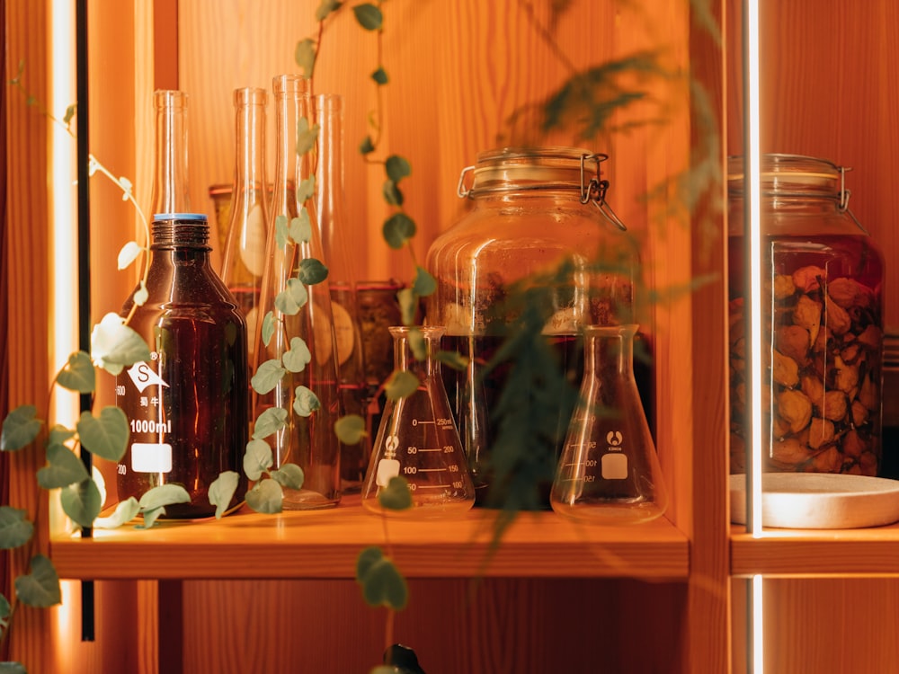 a shelf filled with lots of bottles and jars