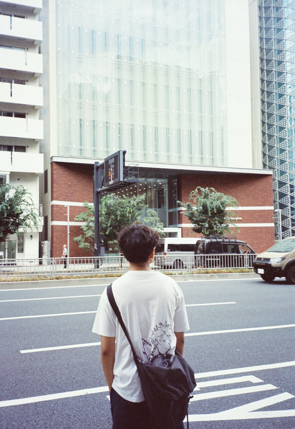 a man standing in the middle of a street