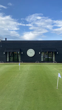 A sleek, modern golf putting green with a focus on precision and minimalistic design, reflecting high-performance sports technology.