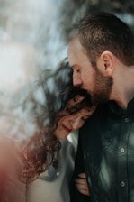 A close-up shot of two performers sharing an intimate moment on set.
