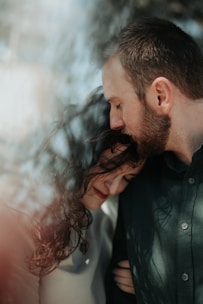 A close-up shot of two performers sharing an intimate moment on set.