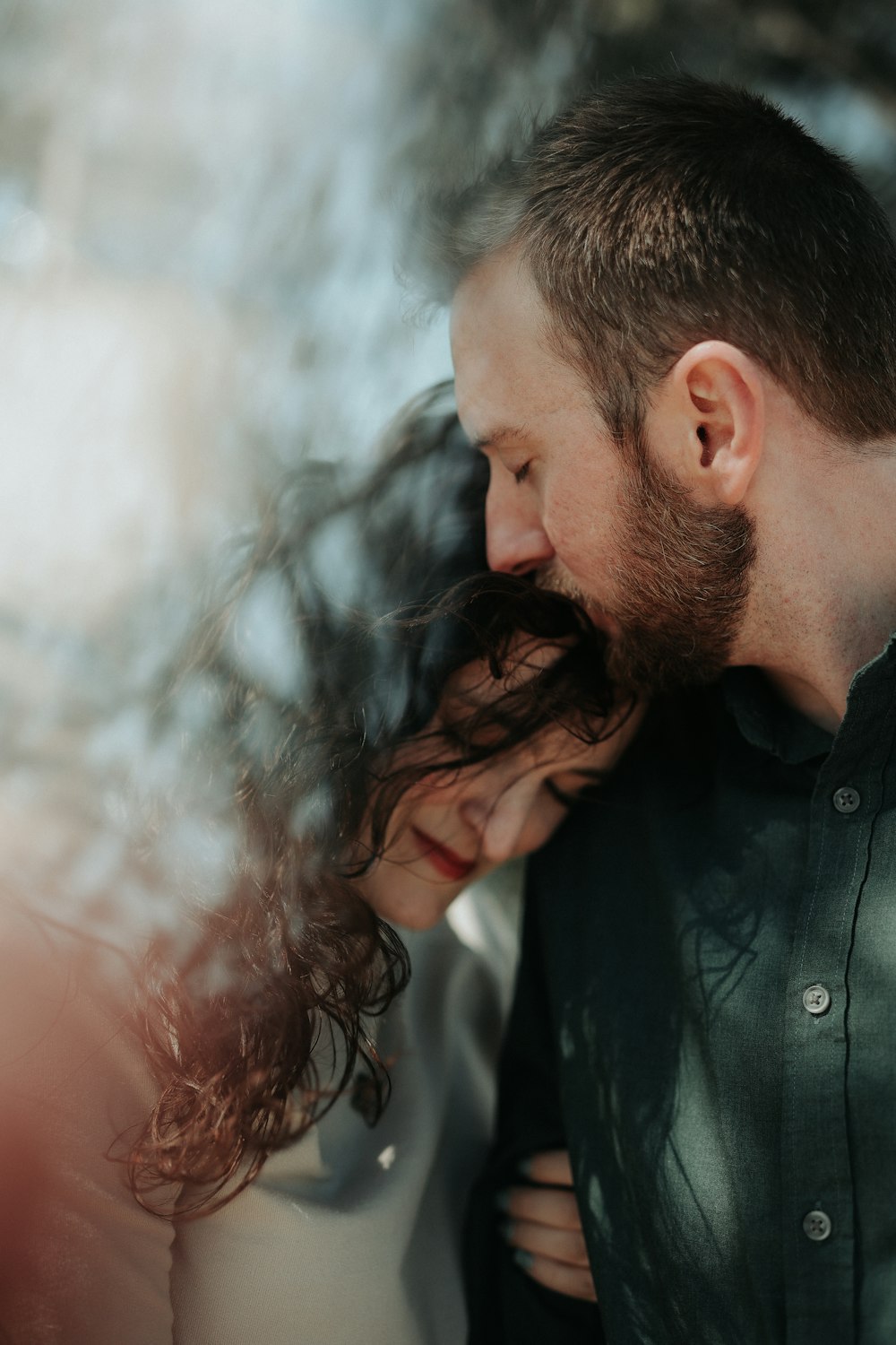 a man and a woman standing next to each other