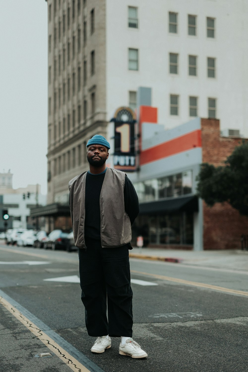 a man standing in the middle of a street