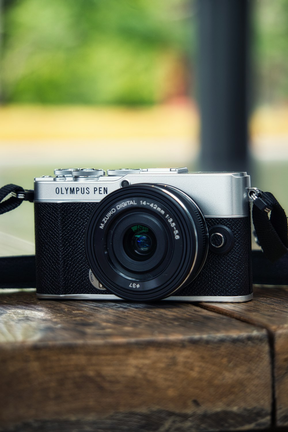 a camera sitting on top of a wooden table