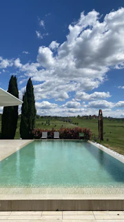 A pristine infinity pool overlooking the lush greenery of the Texas Hill Country on a Hillcrest Luxe estate