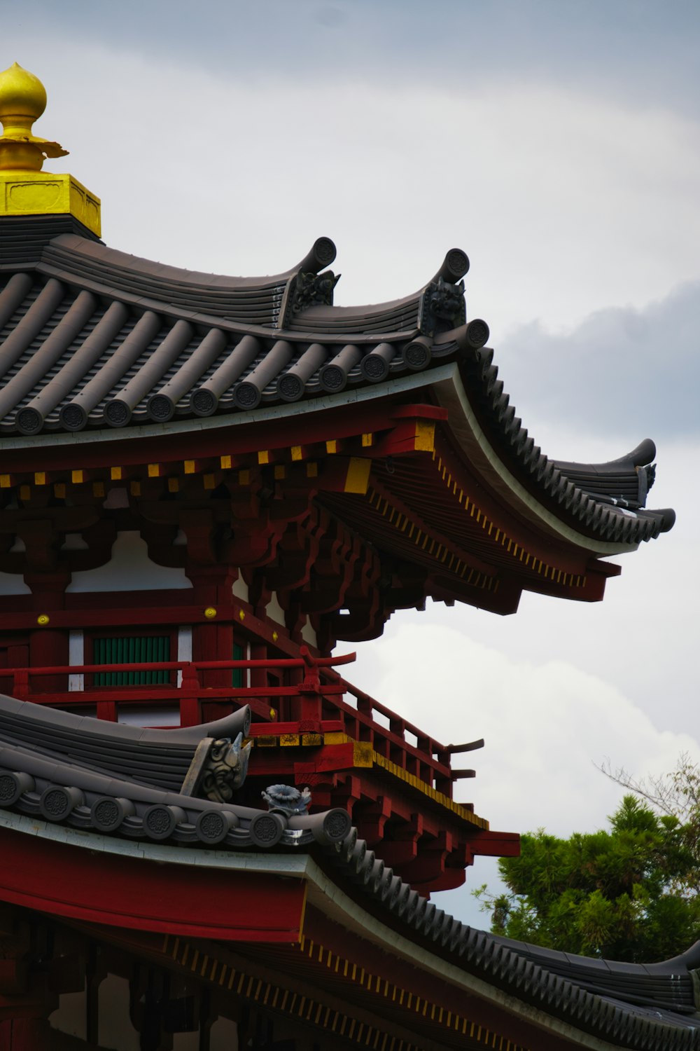 a tall red building with a yellow top