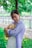 a woman holding a teddy bear in her arms