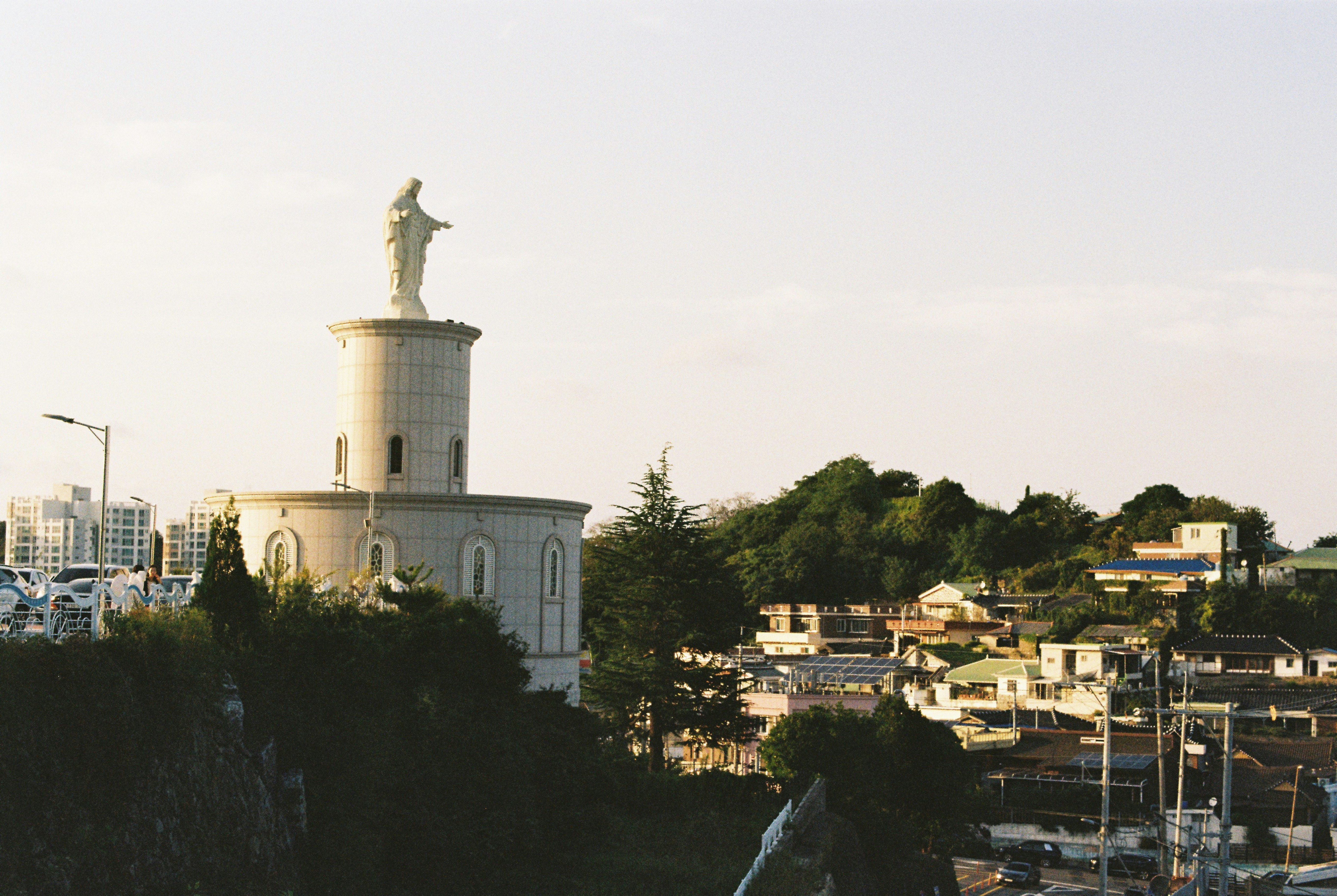 a large white building with a statue on top of it