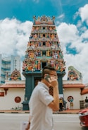A devotee interacting with a temple through a mobile app chat feature.