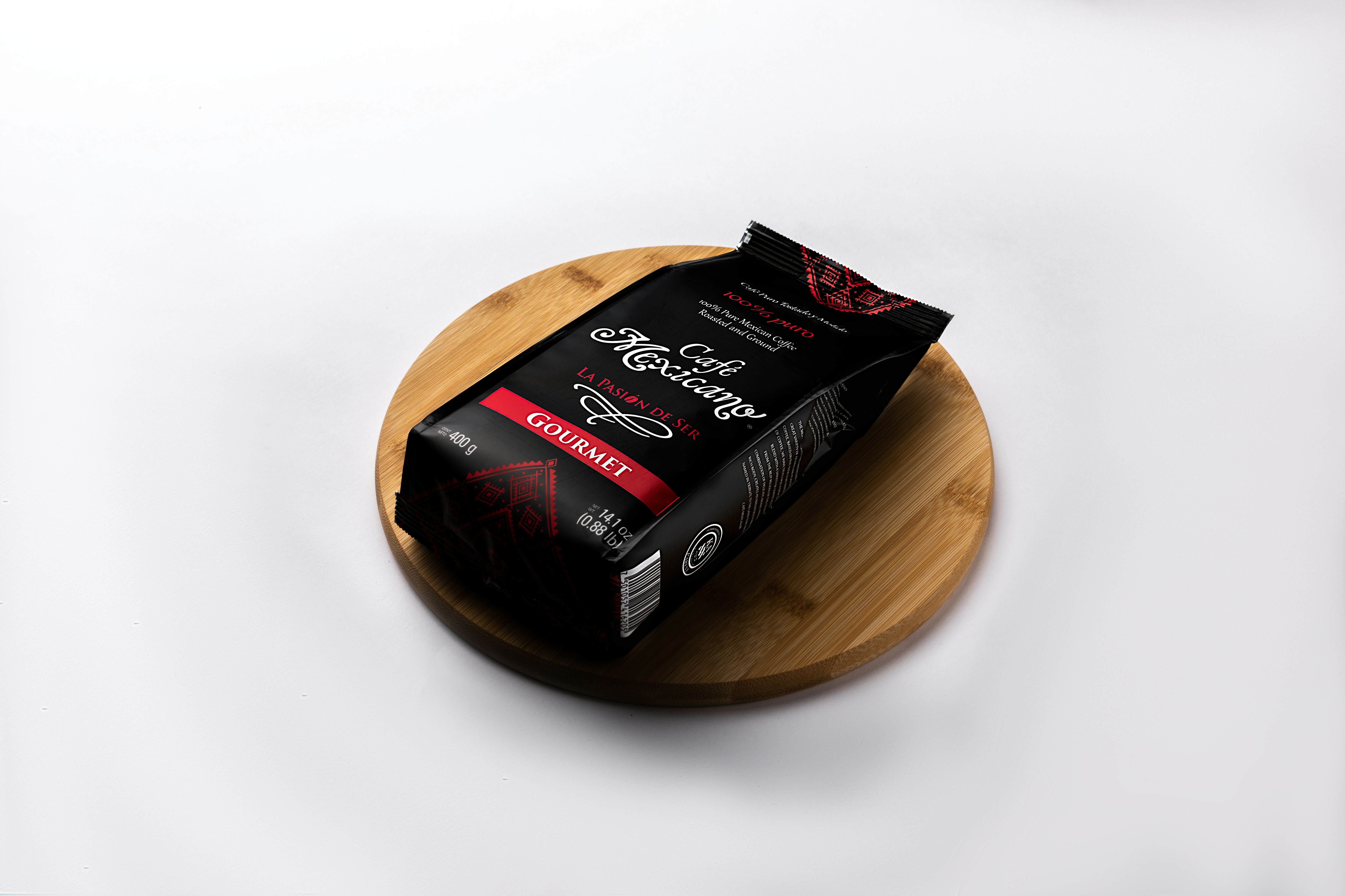 a box of chocolate sitting on top of a wooden plate