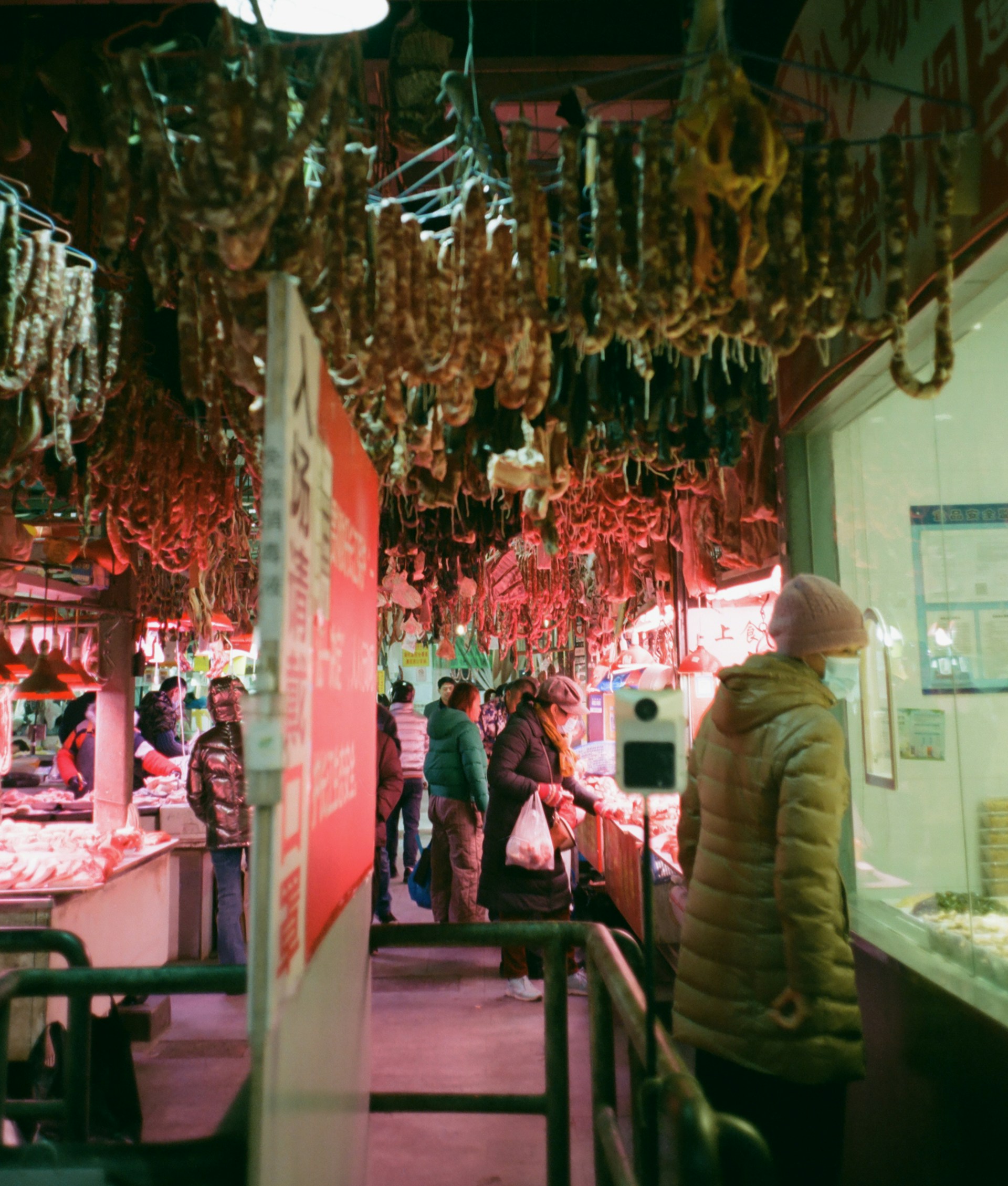 An intimate moment at a bustling Potsdam food market, where a couple samples fresh local delicacies under warm, golden light.