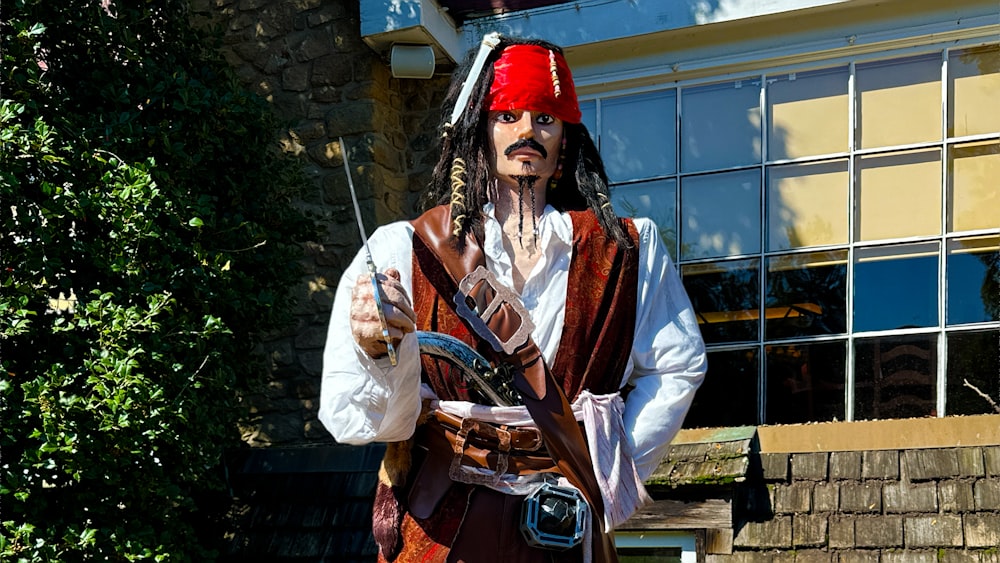 a man dressed as a pirate holding a gun
