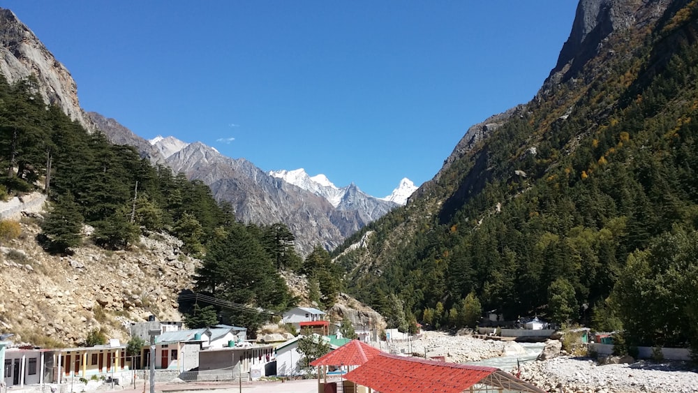 a red roof sits on the side of a mountain