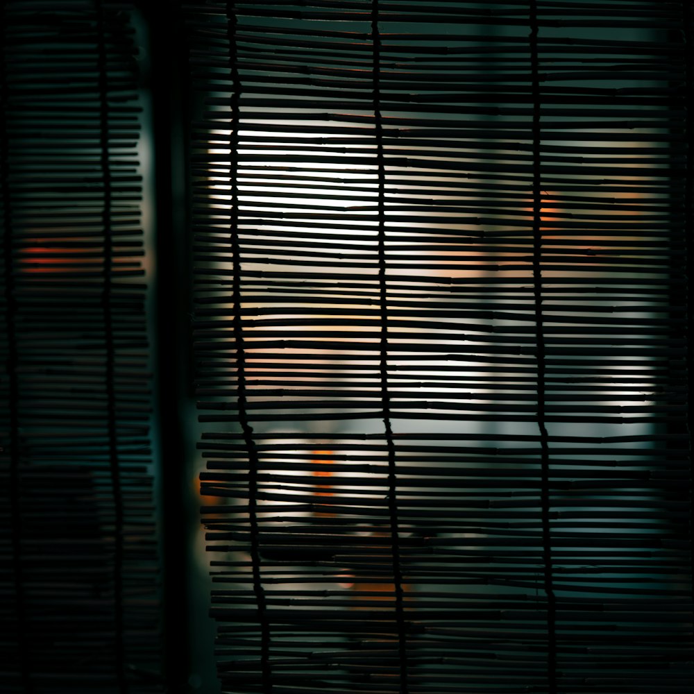 a close up of a window with blinds on it