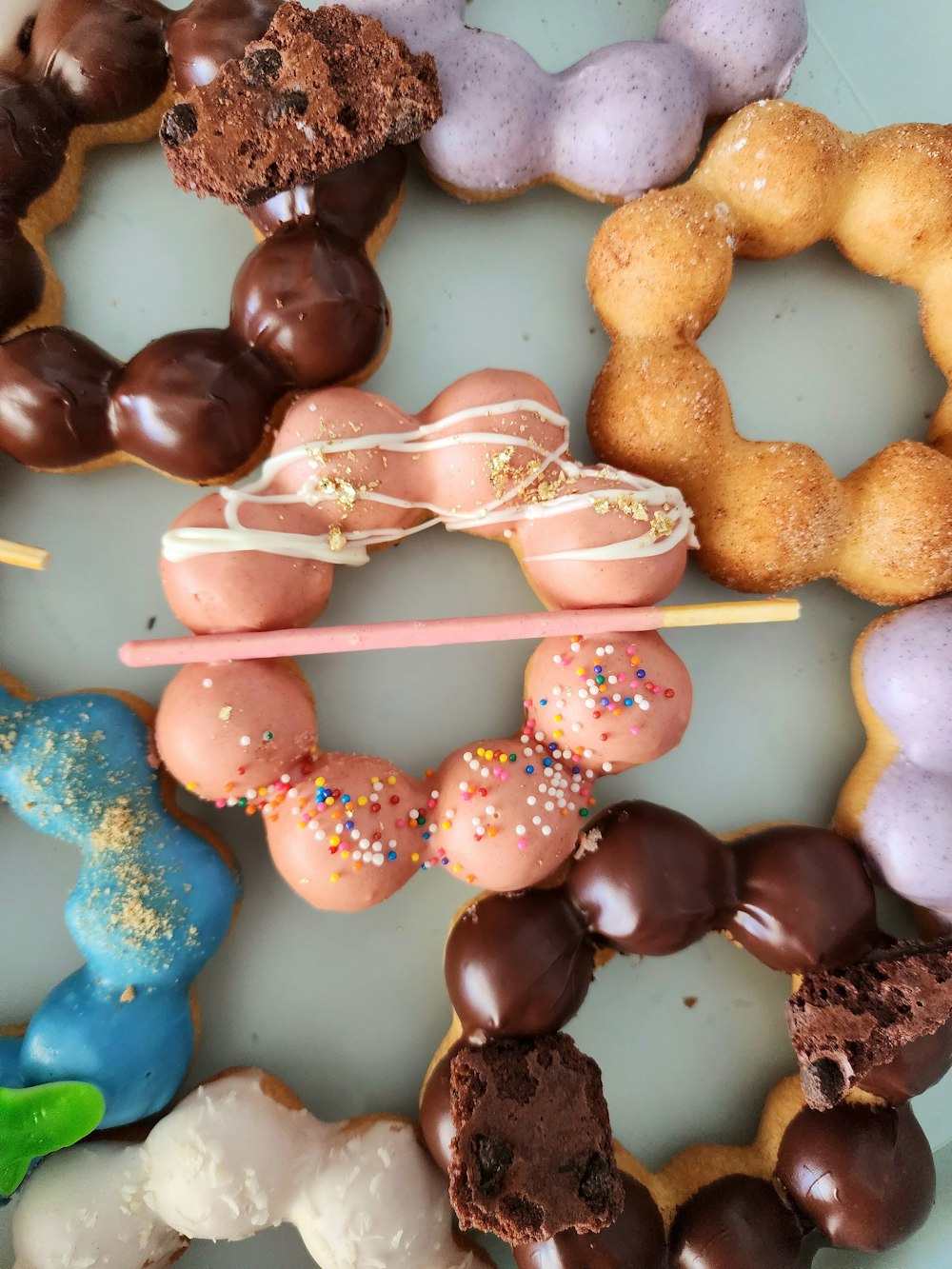 a white plate topped with lots of donuts