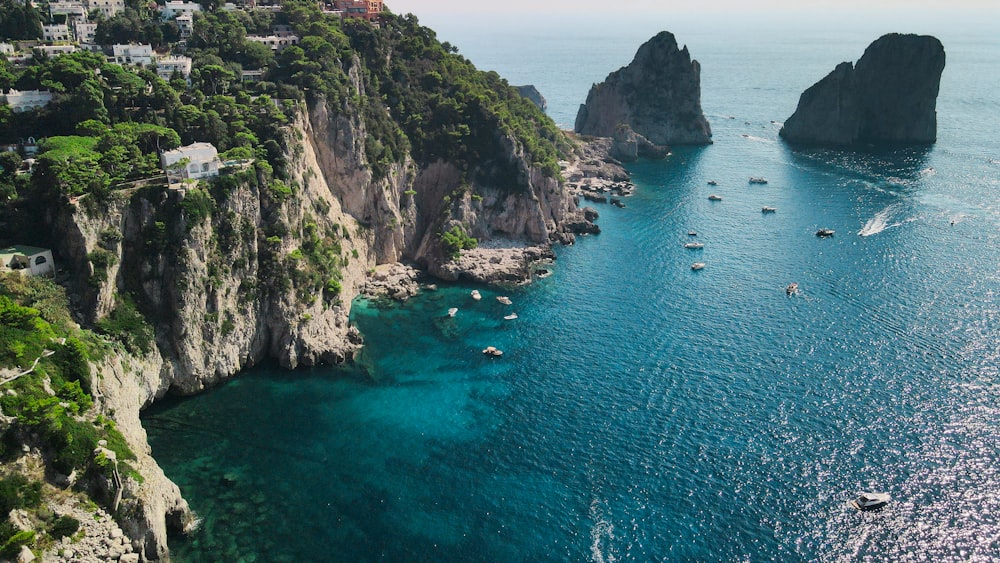 a group of boats floating on top of a body of water