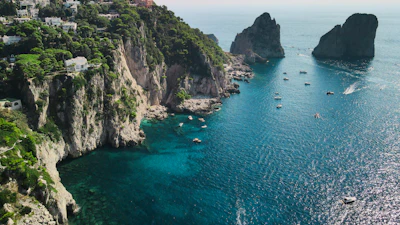 a group of boats floating on top of a body of water