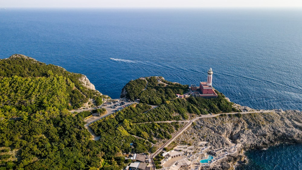 an aerial view of a lighthouse on a small island