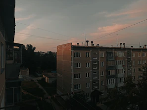 The exterior view of a newly constructed residential building in Greater Noida during sunset