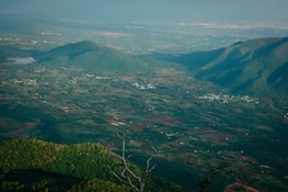 Scenic view of Jezreel Valley with fields and hills under a clear sky.