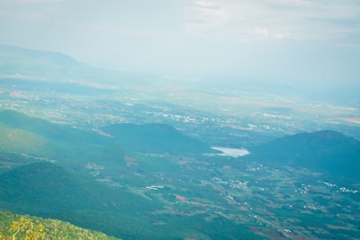 Aerial view of a lush green landscape with farmland.