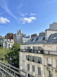 Architect reviewing building blueprints on a construction site in Paris.