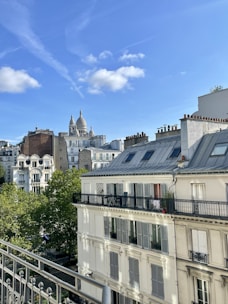 Architect reviewing building blueprints on a construction site in Paris.