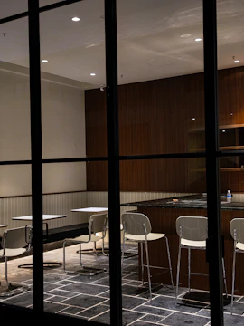 A busy restaurant dining area with clear, fresh water taps.