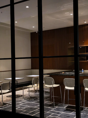 A modern dining area with a modular table and chairs designed for easy rearrangement and comfort.