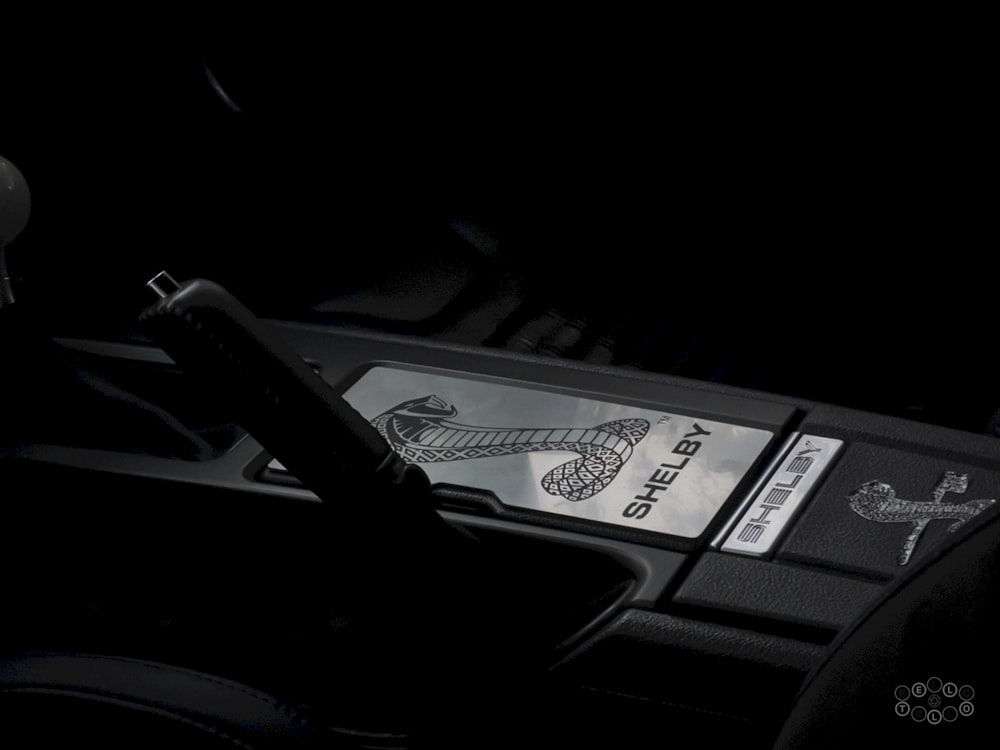 the steering wheel of a car in the dark