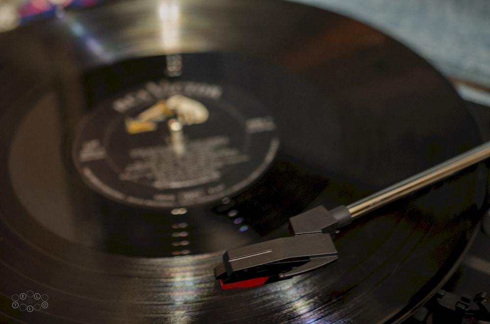 a close up of a record player with a clock on it