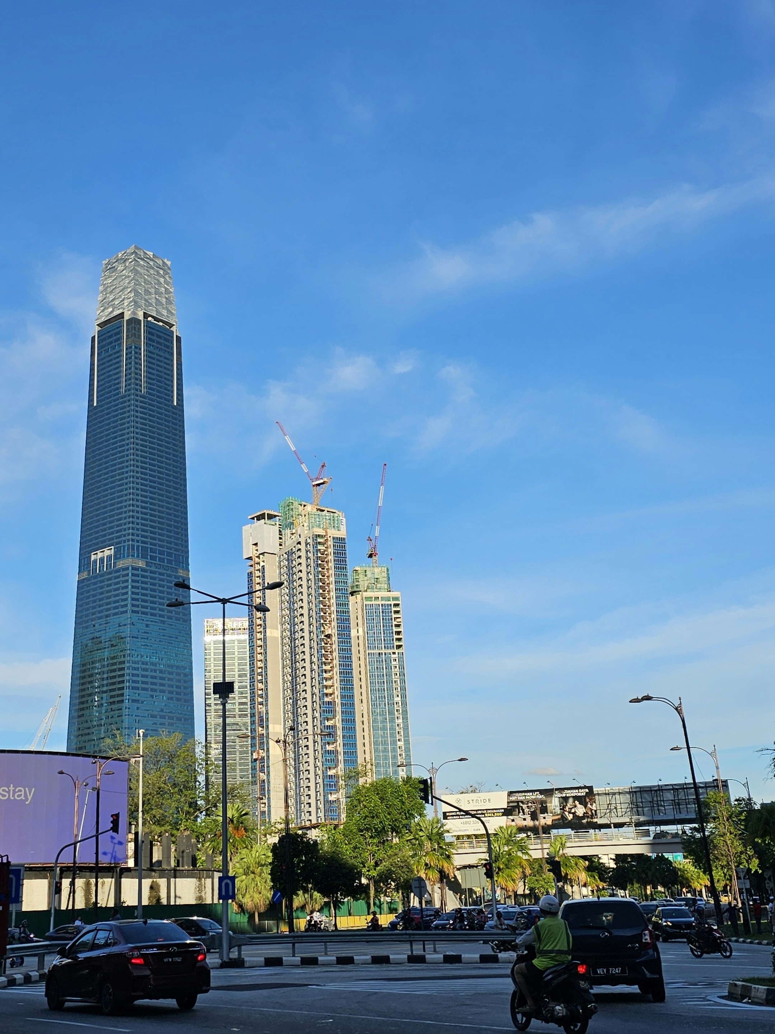 a city street filled with traffic and tall buildings