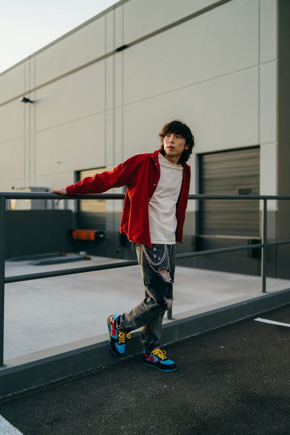 a young man riding a skateboard down a street