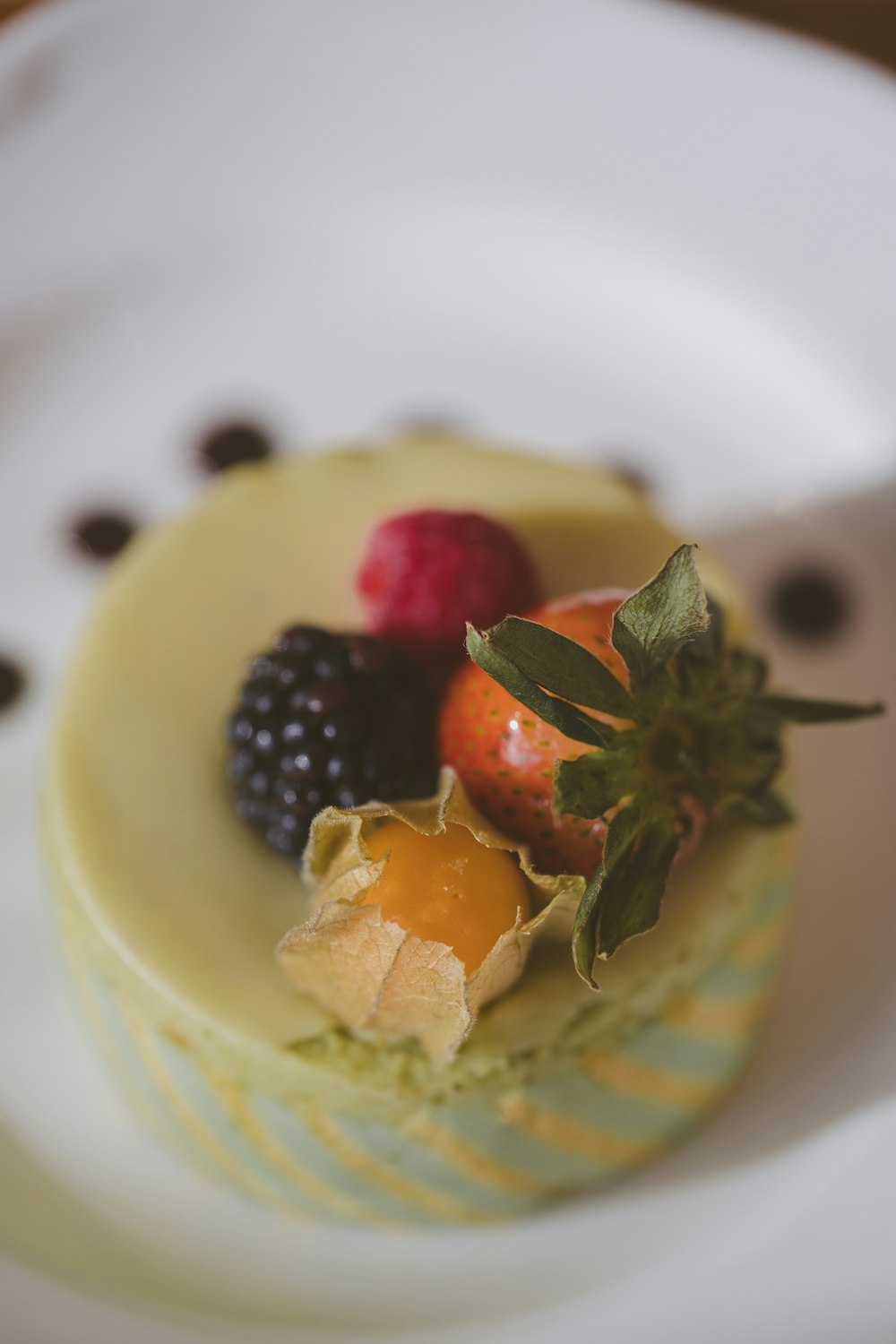 a dessert with fruit on a plate on a table