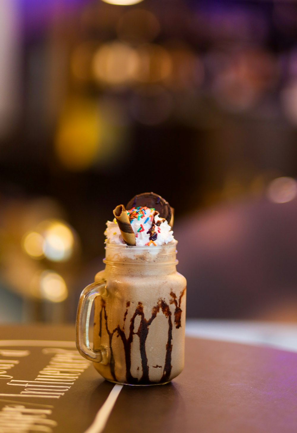 a chocolate milkshake with sprinkles on top