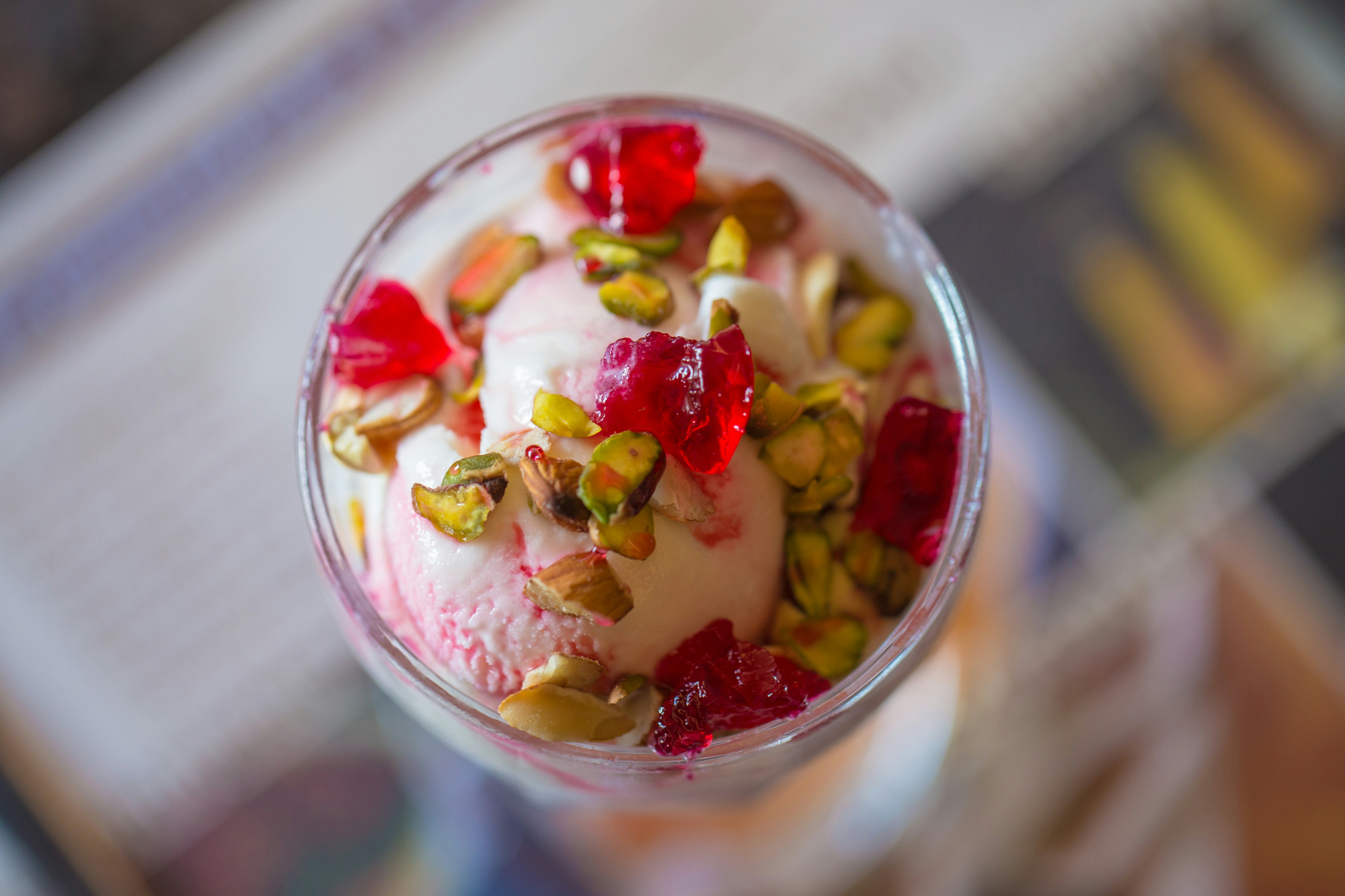 a dessert with fruit and nuts in a glass