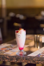 a glass of ice cream on a table