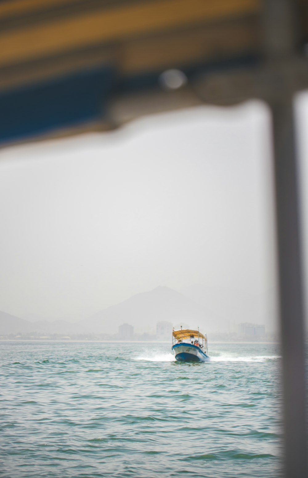 a boat traveling across a large body of water